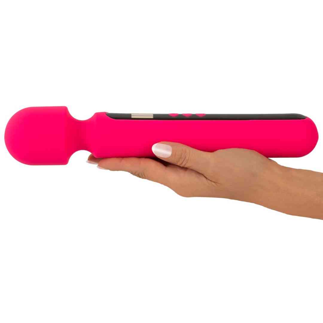 Hand hält den Pink Sunset Wand Vibrator