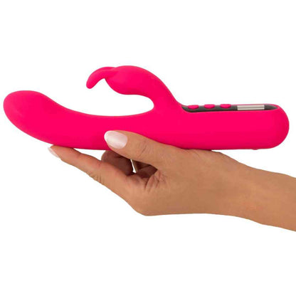 Hand hält den Pink Sunset Rabbit Vibrator